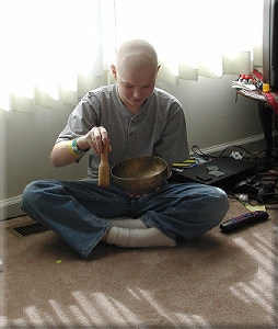 Easter Sunday, 2002 - Hunter demonstrates the use of a Tibetan healing bowl to soothe his heart chakra